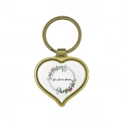 The Front Side Of Heart Shaped Keychain With Embossed Border