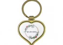 The Front Side Of Heart Shaped Keychain With Embossed Border