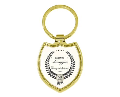 The Front Side Of Shield Shaped Keychain With Embossed Border